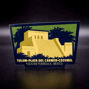 May include: A vintage-style illustration of a Mayan pyramid with palm trees in the background. The text reads "Tulum-Playa del Carmen-Cozumel Yucatan Peninsula, Mexico".