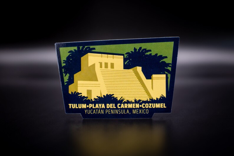 May include: A vintage-style illustration of a Mayan pyramid with palm trees in the background. The text reads "Tulum-Playa del Carmen-Cozumel Yucatan Peninsula, Mexico".
