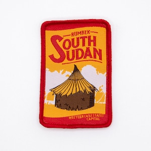 Resemärke i Sydsudan: Retro Rumbek-design, strykbar