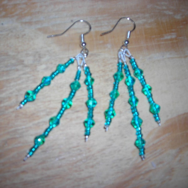 Triple drop dangle earrings in sparkly green Austrian crystals with seed bead spacers with hypoallergenic earwires