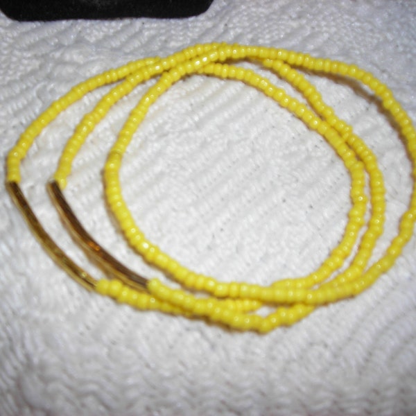 4 Sunny yellow bracelets with gold bar tubes.Yellow seed bead bracelets. Ladies stretch bracelets. Bright gold tube accents. Sunshine bright