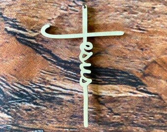 May include: A wooden cross with the word "Jesus" written in a cursive font on the vertical beam.