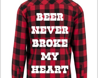 May include: Red and black plaid flannel shirt with the text "Beer Never Broke My Heart" printed in white on the back.