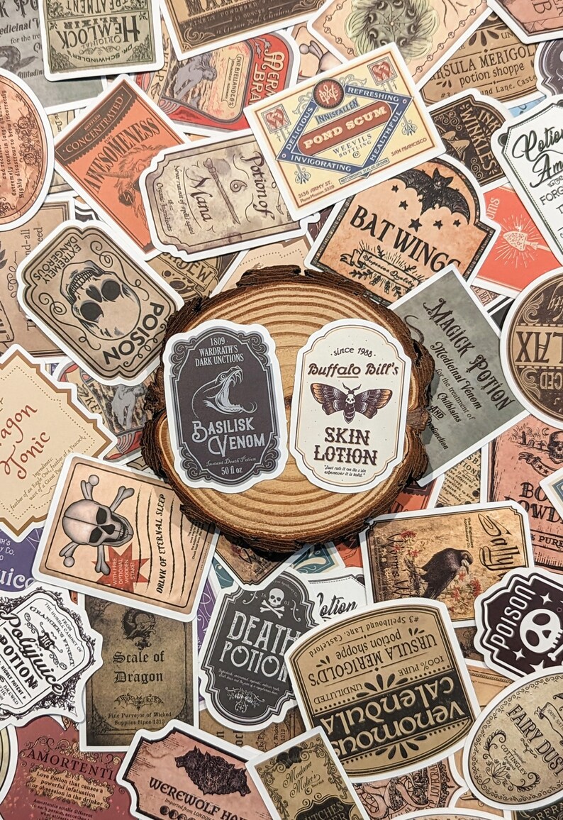 May include: A collection of vintage-style stickers featuring potion labels with names like "Basilisk Venom", "Death Potion", "Bat Wings", and "Magick Potion". The stickers are printed on white paper with black and brown ink and have a distressed, aged look.