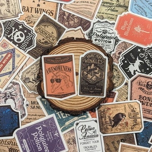 May include: A collection of vintage-style potion bottle stickers with various designs and text, including "Polyjuice Potion", "Bat Wings", "Moondew", "Concentrated Awesomeness", "Inkcap Wrinkles", "Lotion of Amnesia", "Magic Mushrooms", "Sallyjack", "Potion of Superior Healing", and "Amortentia". The stickers are arranged on a wooden surface.