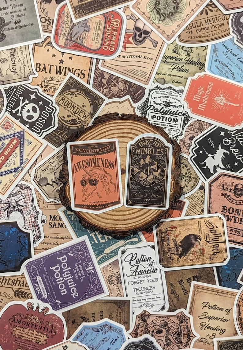 May include: A collection of vintage-style potion bottle stickers with various designs and text, including "Polyjuice Potion", "Bat Wings", "Moondew", "Concentrated Awesomeness", "Inkcap Wrinkles", "Lotion of Amnesia", "Magic Mushrooms", "Sallyjack", "Potion of Superior Healing", and "Amortentia". The stickers are arranged on a wooden surface.