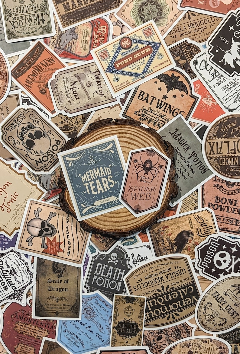 May include: A collection of vintage-style potion bottle labels with various designs and text, including "Mermaid Tears", "Spider Web", "Death Potion", "Scale of Dragon", "Magick Potion", and "Bat Wings".