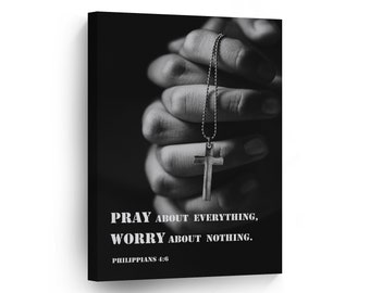 May include: Black and white photo of hands clasped in prayer with a silver cross necklace. The text "Pray about everything, worry about nothing. Philippians 4:6" is printed below the hands.