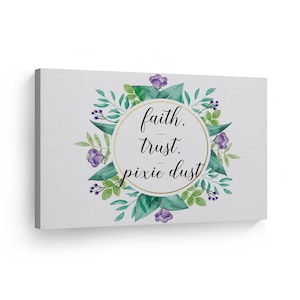 May include: A watercolor painting of a floral wreath with purple flowers and green leaves. The wreath surrounds a gold circle with the text "faith, trust, pixie dust" in black.