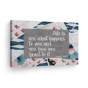 May include: A motivational quote on a canvas print with a geometric pattern in shades of blue and pink. The quote reads "Life is 10% what happens to you and 90% how you react to it." - Charles R. Swindoll.