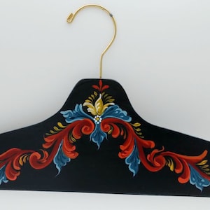 Decorated rosemaling wooden clothes hanger