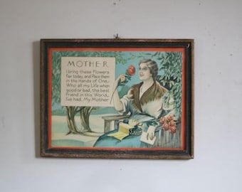 May include: Framed vintage print featuring a woman holding a rose, with text that reads "MOTHER." The artwork has a brown frame and depicts a woman in a garden setting, with a bouquet of roses and a poem dedicated to mothers.