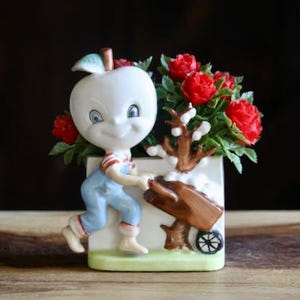 May include: A rustic wooden sign with the text "Welcome to our home" in a handwritten style. The sign is rectangular, with a distressed finish, and features a simple, inviting design. It's suitable for indoor or outdoor use.