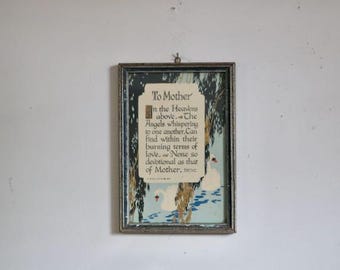 May include: Vintage framed print with the text "To Mother" in an ornate font. The artwork features a serene scene with swans on a blue lake, framed by trees. The frame is a distressed silver color.