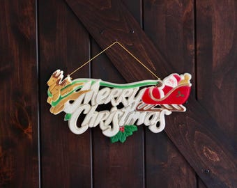 Merry Christmas Sign, Vintage Christmas Decor, Cute Santa in Sleigh with Reindeer & Holly, Plastic Kitschy Holiday Wall Art, Collector Gift