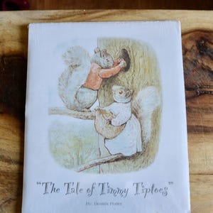 May include: A vintage children's book cover featuring an illustration of two squirrels. One squirrel is reaching into a tree hollow, while the other holds a bag. The title "The Tale of Timmy Tiptoes" is displayed below the illustration.