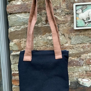 Handbag. Dark blue wool. Gorgeous green leaf lining. Inside pocket. 10” by 11”.