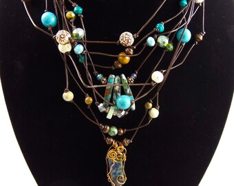 Leather cord necklace with multiple strands, turquoise and blue stones, wire wrapped stones on multistrand leather cord,