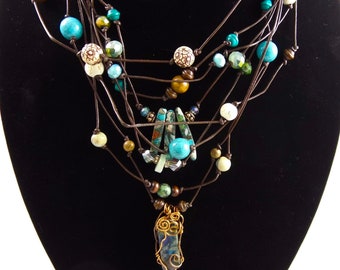 Leather cord necklace with multiple strands, turquoise and blue stones, wire wrapped stones on multistrand leather cord,