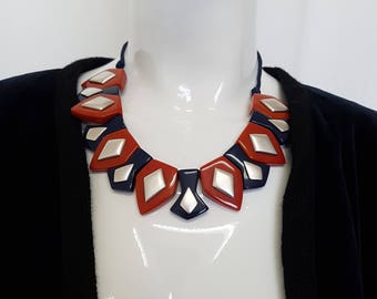 Vtg 70s YSL Yves Saint Laurent by Robert Goossens Art Deco Style Galalith Resin Statement Bib Necklace in Red, Blue & Silver - Signed.