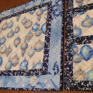 Quilted blue Christmas table topper and 6 matching mug rugs.