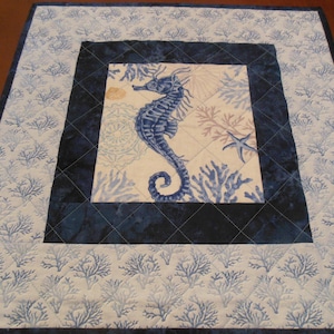 Quilted seahorse table topper.