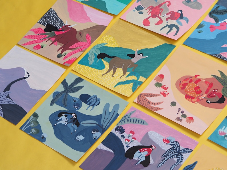 May include: A set of colorful illustrated cards featuring various scenes with people, animals, and plants. The cards are painted in a whimsical style with bright colors and bold lines.
