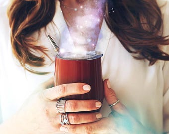 May include: A deep red stainless steel tumbler with a clear lid and a silver metal straw. A digital effect of swirling purple and white cosmic smoke with small glowing stars rises from the top of the cup, creating a magical appearance.