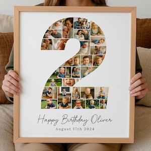 May include: A framed print featuring a collage of photos arranged in the shape of the number 2. The photos depict a baby and family. The text "Happy Birthday Oliver" and "August 17th 2024" are printed at the bottom.
