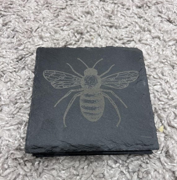 Slate Bee coaster engraved our design bee formation rough cut slate
