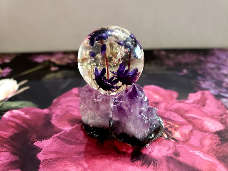 Resin Orb Sphere with a real flowers inside on a real Purple Etsy