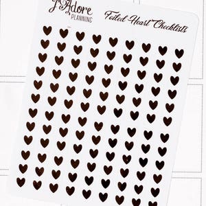 May include: A sheet of black foiled heart stickers. The sheet has the text "Foiled Heart Checklists" and the logo "I Adore Planning".