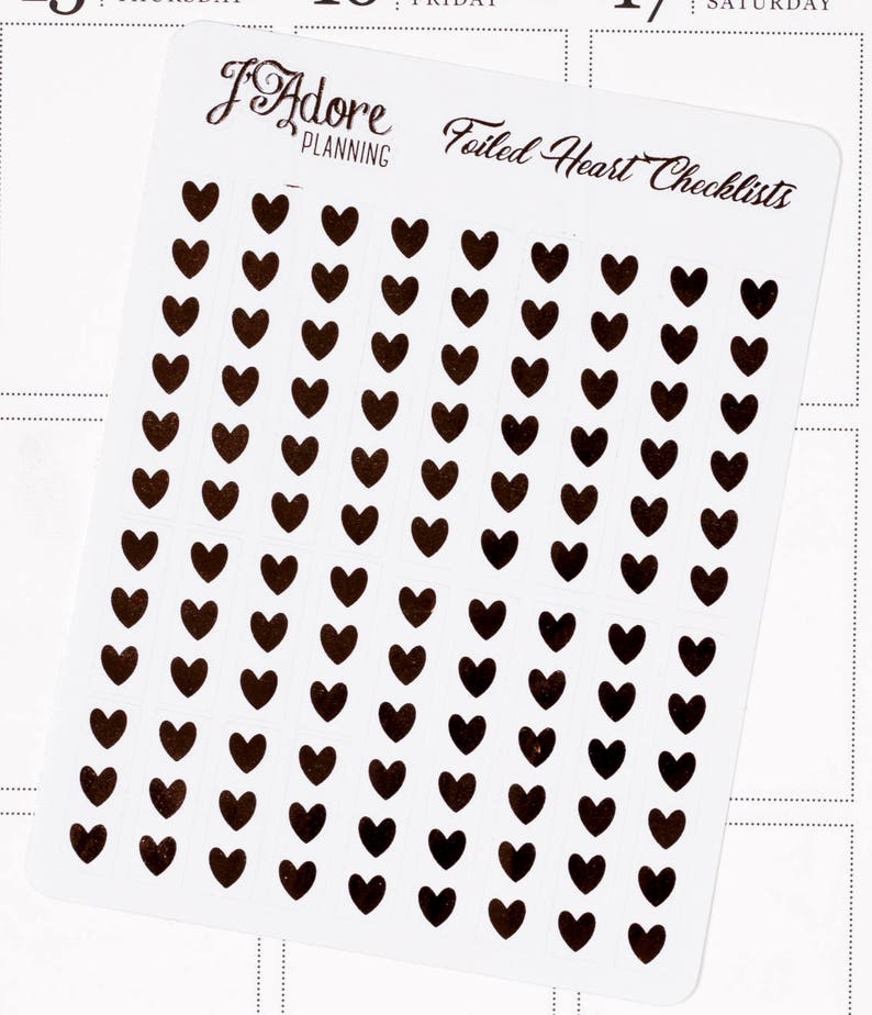 May include: A sheet of black foiled heart stickers. The sheet has the text "Foiled Heart Checklists" and the logo "I Adore Planning".