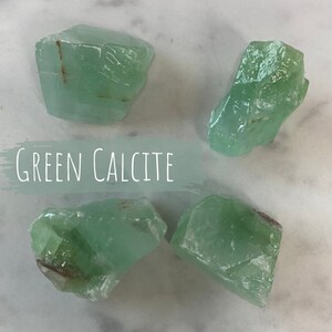 May include: Four pieces of green calcite crystals. The crystals are rough and have a natural, unpolished look.  GREEN CALCITE is written in white text on a green background.