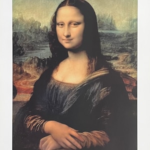 May include: A close-up portrait of the Mona Lisa, a famous painting by Leonardo da Vinci. The subject is a woman with dark hair and a soft smile, wearing a dark blue dress with a delicate neckline. The background is a landscape with a river and mountains.