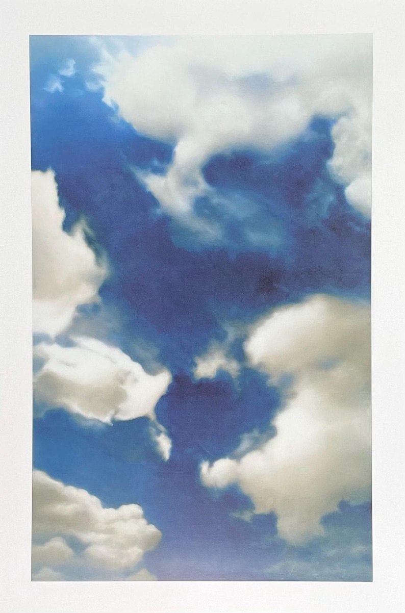 May include: A painting of a blue sky with white clouds. The clouds are fluffy and appear to be moving across the sky.