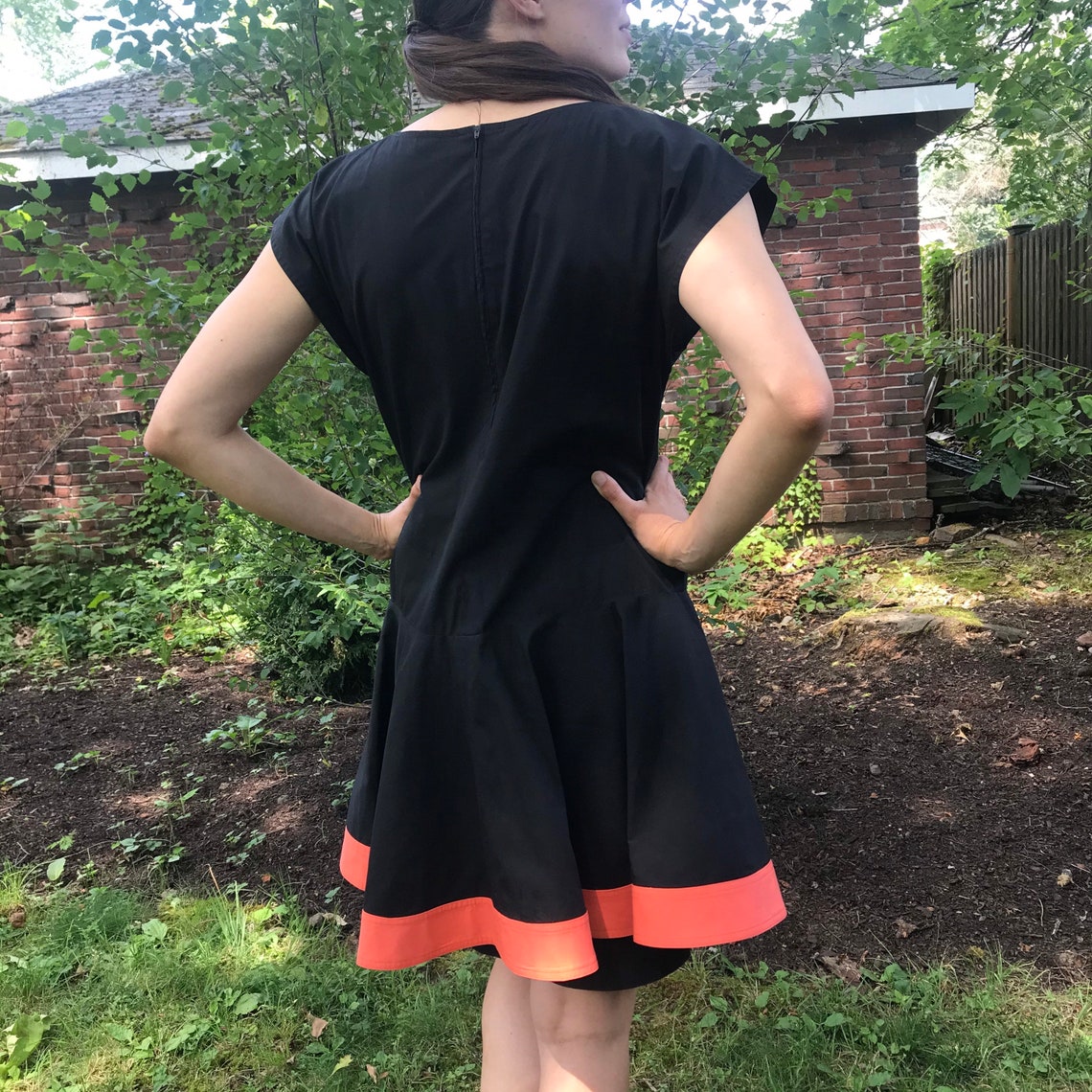 black dress with overskirt