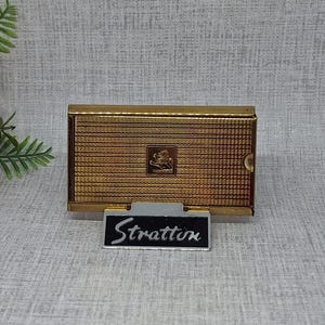 Stratton 'Brush Off'  ~ Gold Tone Metal with Engine Turned Pattern & Demi Lion Crest