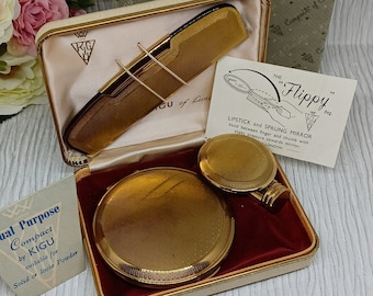 Juego de lápiz labial y peine compactos Kigu Flippy en tono dorado ~ En caja original ~ Estilo vintage de mediados de siglo