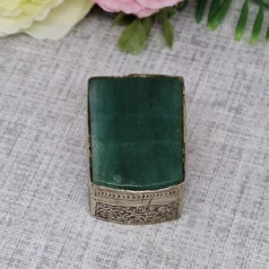 Silver Tone Trinket or Pill Box with a Green Translucent Stone Lid