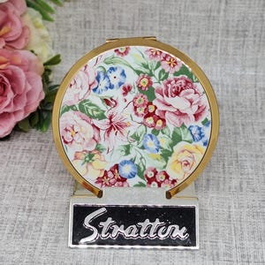 Miroir compact en poudre « Mini Convertible » Stratton ~ émail blanc avec fleurs roses, bleues et jaunes