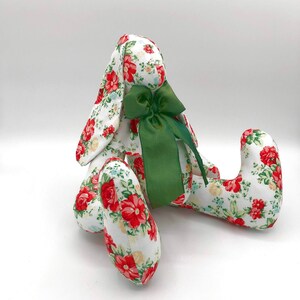 Handmade bunny made from rose print fabric with matching collar and green bow