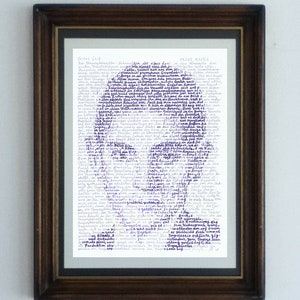 May include: A framed piece of paper with a handwritten text in purple ink. The text is a poem or a story titled "frotes Leid" by Franz Kafka. The frame is dark brown wood.