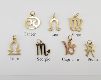 May include: Twelve gold zodiac charms, each depicting a different astrological sign: Cancer, Leo, Virgo, Libra, Scorpio, Sagittarius, Capricorn, Aquarius, Pisces, Aries, Taurus, and Gemini.