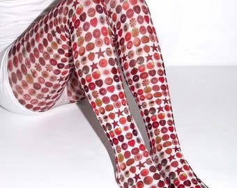 May include: Sheer white tights featuring an all-over print of various red buttons, stars, and circular shapes in shades of crimson, scarlet, and maroon. The pattern is densely packed across the fabric, creating a repetitive graphic design.