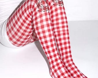 May include: Sheer tights featuring a red and white gingham check pattern. The fabric includes a graphic print of small black ants clustered in a circular formation positioned over each knee area of the hosiery.