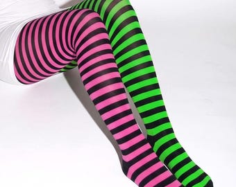 May include: A pair of opaque tights featuring a bold striped pattern. One leg displays horizontal black and neon pink stripes, while the other leg features horizontal black and neon green stripes, extending from the upper thigh to the toes.