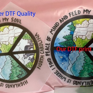 May include: Two circular DTF transfers featuring a peace sign design with a landscape illustration of mountains, pine trees, a night sky, and bears. The text reads HIGHLANDS IS WHERE I FIND PEACE OF MIND AND FEED MY SOUL and NORTH CAROLINA.