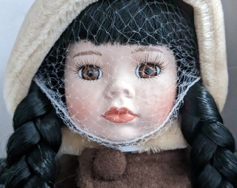 The Leonardo Collection Eskimo LP4460 Porcelain Doll with Seal accessory