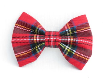 May include: Red plaid bow tie with black, white, and yellow stripes.